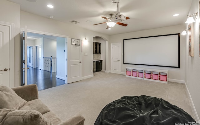 cinema featuring carpet floors and ceiling fan