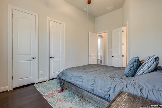 bedroom featuring ceiling fan and dark wood-type flooring