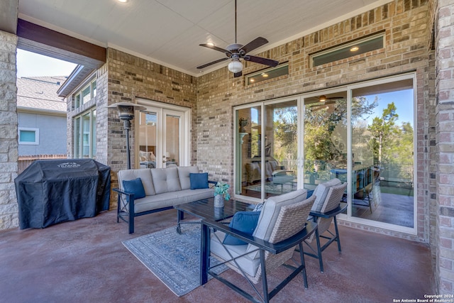 view of patio / terrace with an outdoor living space, area for grilling, and ceiling fan