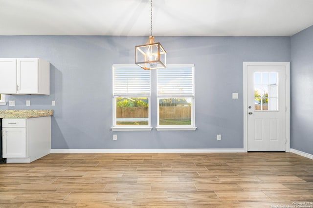 5882 Castle Run, San Antonio, TX 78218 - kitchen featuring white cabinets, light wood-style floors, plenty of natural light, and baseboards