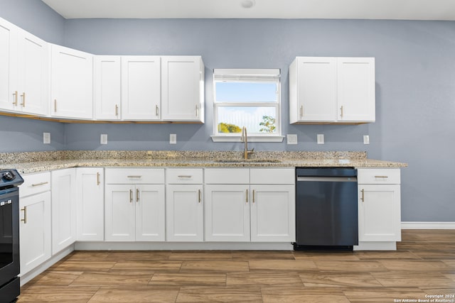 kitchen with white cabinets, appliances with stainless steel finishes, and sink