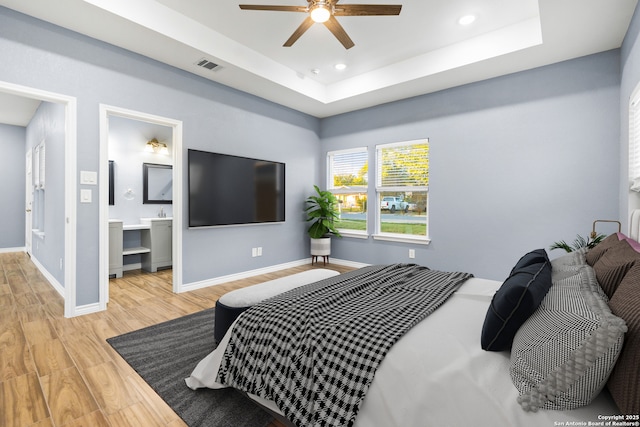 5882 Castle Run, San Antonio, TX 78218 - bedroom featuring wood finished floors, a tray ceiling, baseboards, recessed lighting, and a ceiling fan