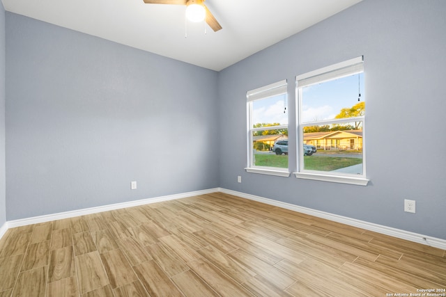 spare room featuring ceiling fan and light hardwood / wood-style floors