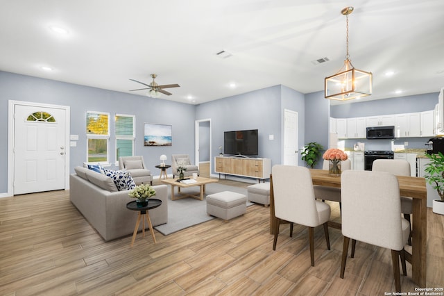 5882 Castle Run, San Antonio, TX 78218 - living area with light wood-type flooring, a ceiling fan, and recessed lighting