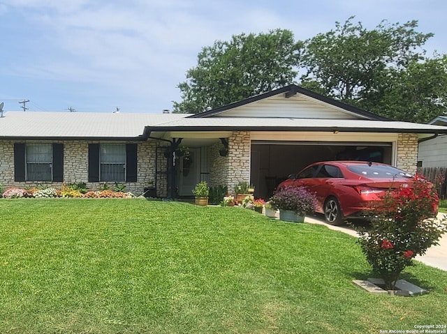 single story home with a garage and a front lawn