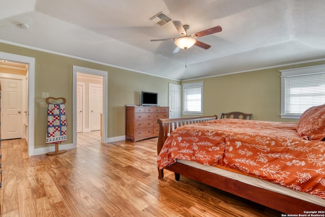 1333 Continental Dr S, Pleasanton, TX 78064 - bedroom with light wood-type flooring, crown molding, a raised ceiling, baseboards, and a ceiling fan