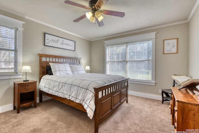 bedroom featuring a ceiling fan, light colored carpet, crown molding, and baseboards