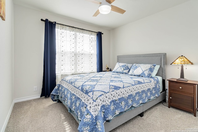 bedroom featuring ceiling fan and light colored carpet