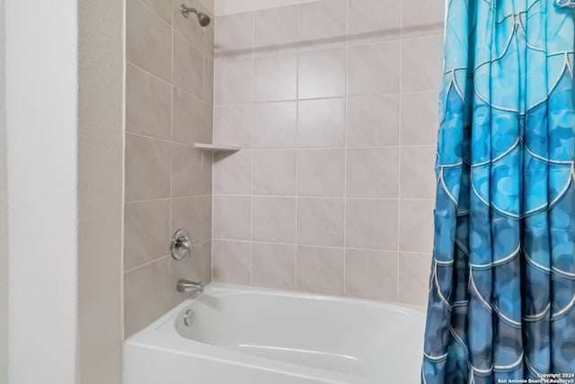 bathroom featuring shower / bath combo with shower curtain