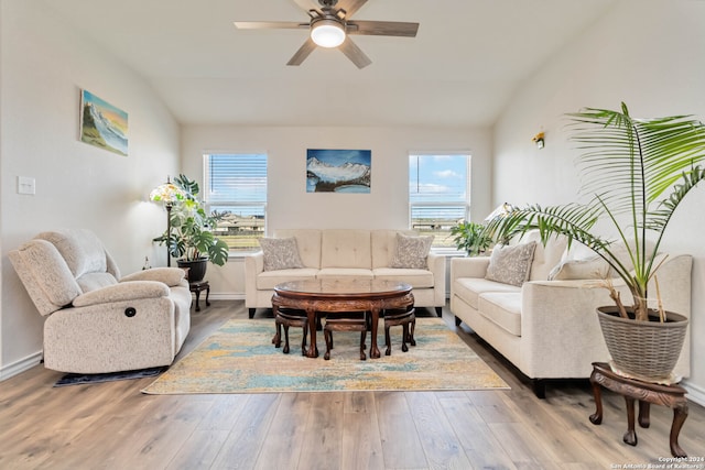 living room with hardwood / wood-style floors, plenty of natural light, and lofted ceiling