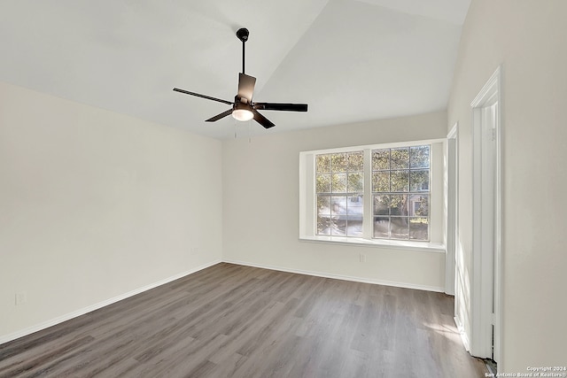 spare room with ceiling fan, hardwood / wood-style floors, and lofted ceiling