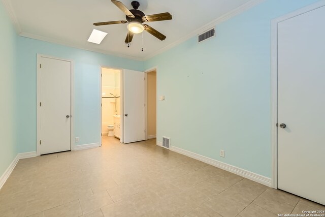 unfurnished bedroom featuring crown molding, connected bathroom, and ceiling fan