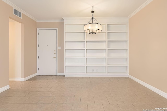7711 Broadway Unit 16B, San Antonio, TX 78209 - spare room with baseboards, crown molding, a chandelier, and built in features