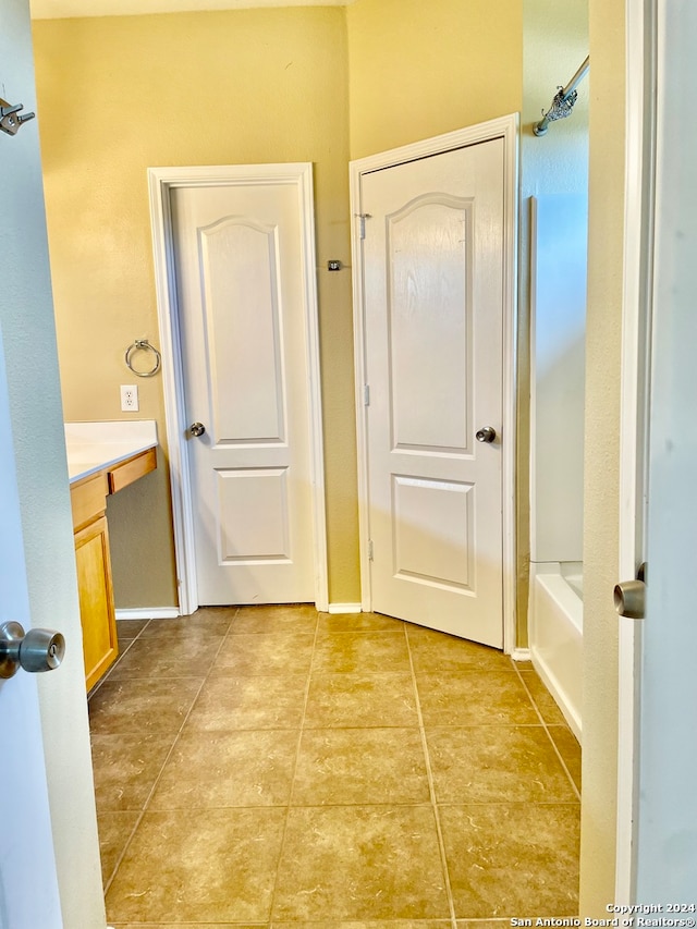 corridor featuring light tile patterned floors