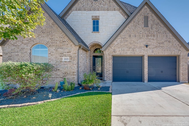 view of front of property with a garage