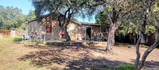 back of property featuring a patio area