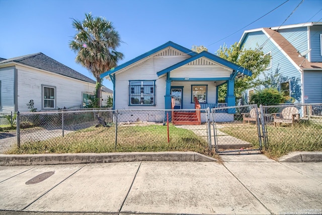 211 Blanco Rd, San Antonio, TX 78212 - shotgun-style home featuring covered porch and a gate