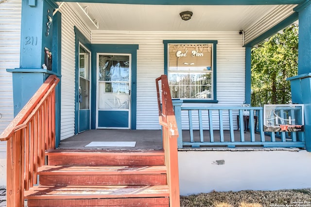 doorway to property with a porch