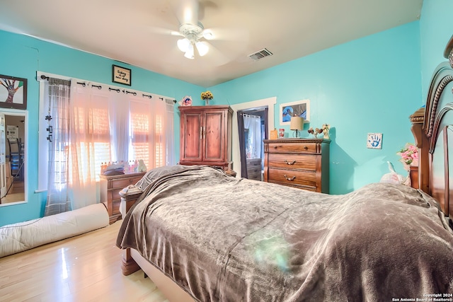 bedroom featuring ceiling fan and light hardwood / wood-style floors