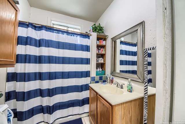 bathroom with tile patterned flooring and vanity