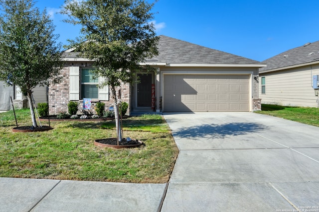 single story home with a front yard and a garage