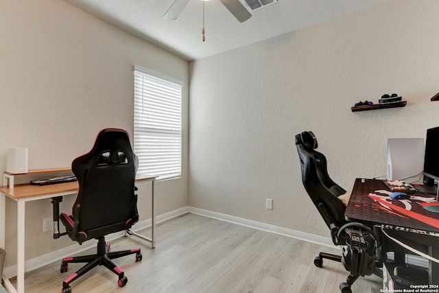 office space with ceiling fan and light wood-type flooring