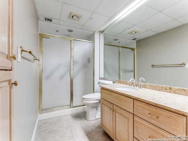 bathroom with vanity, a paneled ceiling, tile patterned floors, and an enclosed shower