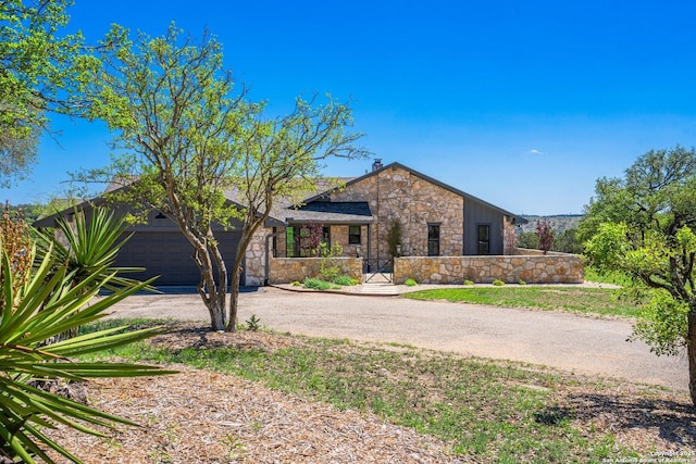160 Mountain Way, Kerrville, TX 78028 - view of front of property featuring stone siding, asphalt driveway, and an attached garage