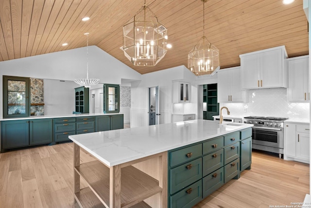 160 Mountain Way, Kerrville, TX 78028 - kitchen with high end stainless steel range, a chandelier, green cabinets, white cabinetry, and wooden ceiling