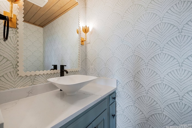 bathroom with vanity and wooden ceiling