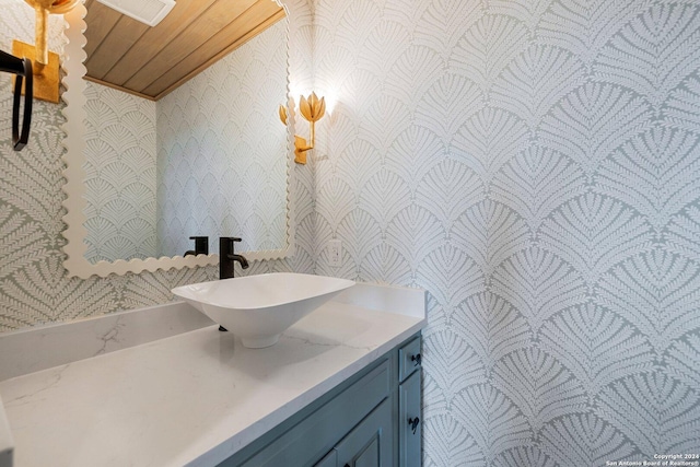 160 Mountain Way, Kerrville, TX 78028 - bathroom with wallpapered walls, vanity, and wood ceiling