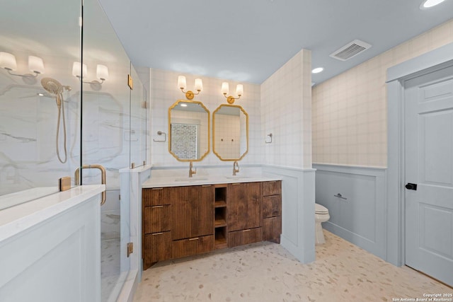 160 Mountain Way, Kerrville, TX 78028 - bathroom with a marble finish shower, double vanity, toilet, and wainscoting