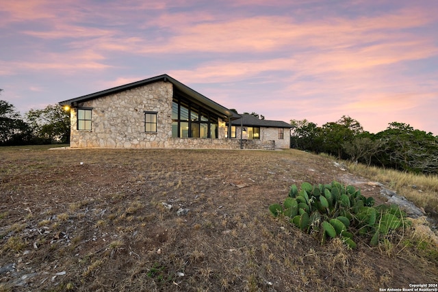 view of property exterior at dusk