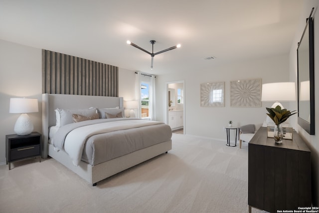 carpeted bedroom featuring connected bathroom