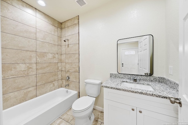 full bathroom featuring tile patterned flooring, vanity, tiled shower / bath combo, and toilet