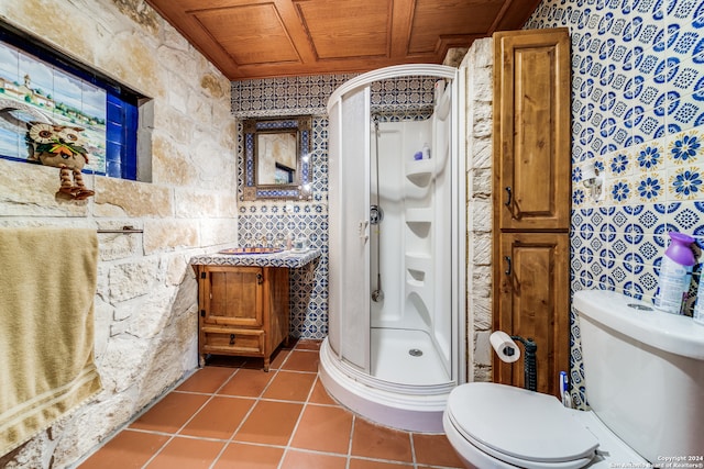 bathroom with wood ceiling, vanity, tile patterned flooring, toilet, and a shower with shower door