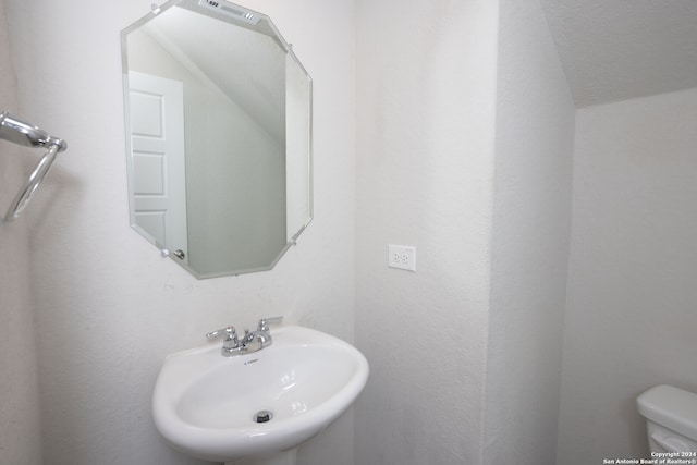 bathroom with toilet and sink