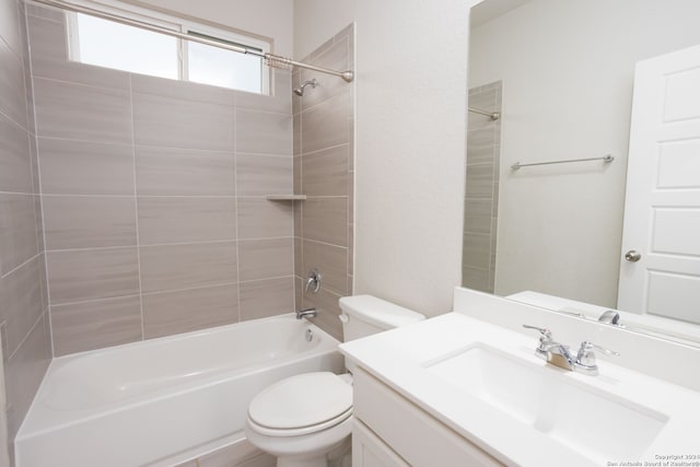 full bathroom with vanity, toilet, and tiled shower / bath