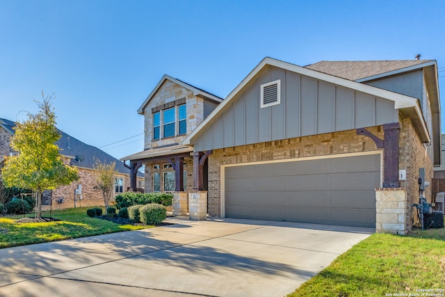 view of front of property with a garage and a front yard