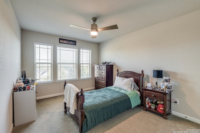 carpeted bedroom with ceiling fan