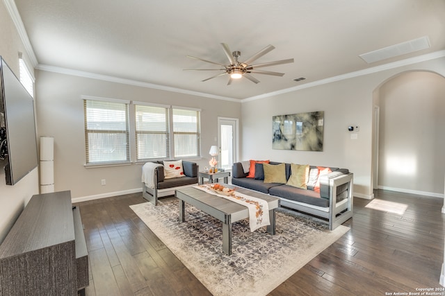 living room featuring ceiling fan, dark hardwood / wood-style floors, and ornamental molding