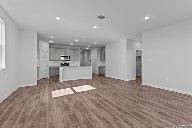 unfurnished living room featuring dark hardwood / wood-style floors