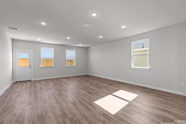 spare room featuring light hardwood / wood-style flooring