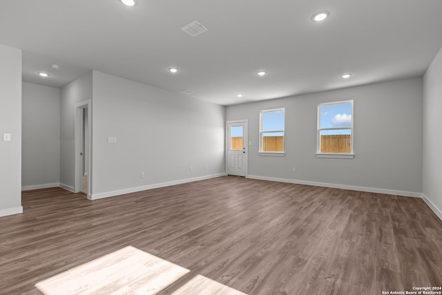 unfurnished room featuring dark hardwood / wood-style flooring