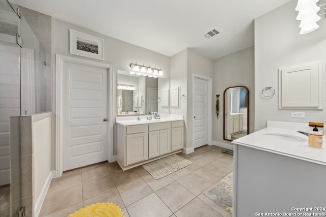 bathroom with tile patterned flooring and vanity