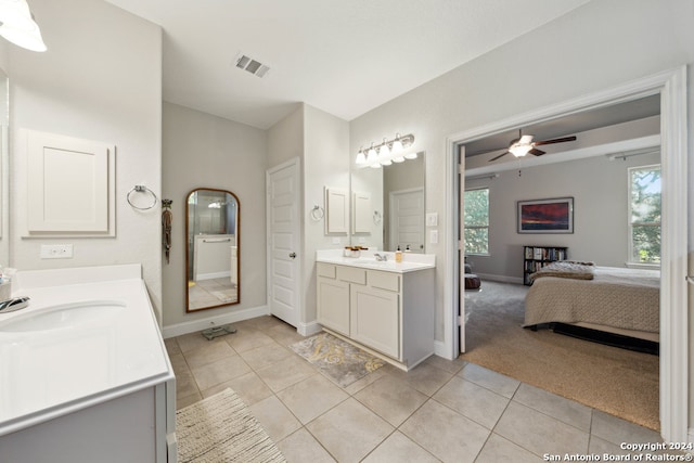 bathroom with tile patterned flooring, vanity, and ceiling fan