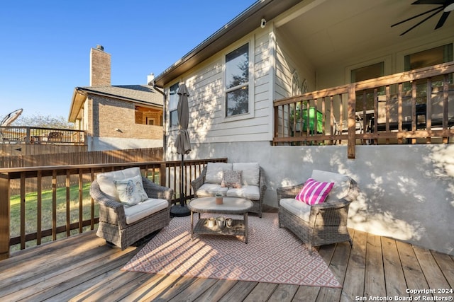 deck with ceiling fan and an outdoor hangout area