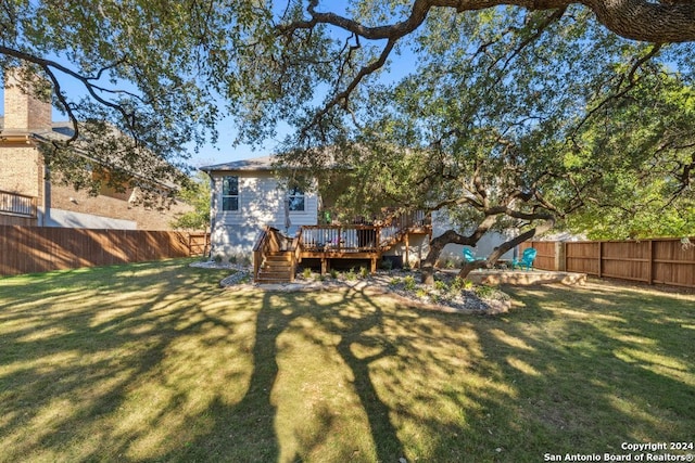 view of yard with a wooden deck