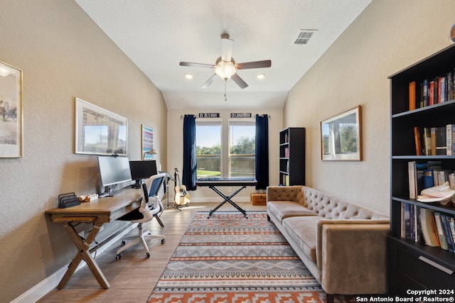 office space with light hardwood / wood-style floors and ceiling fan