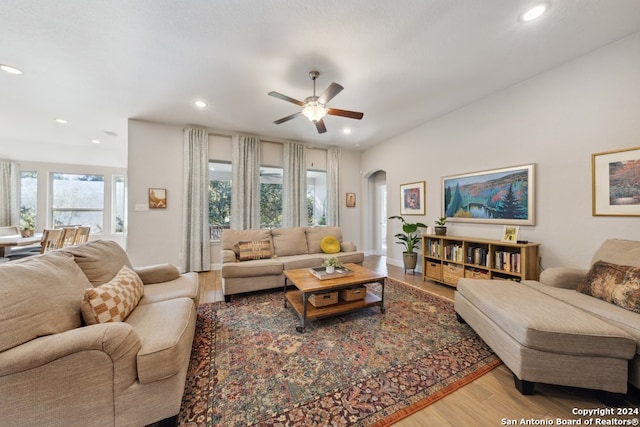 living room with hardwood / wood-style floors and ceiling fan